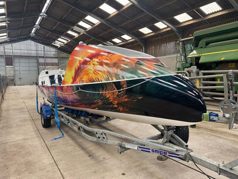An image of the vinyl wrap on the upside down boat.
